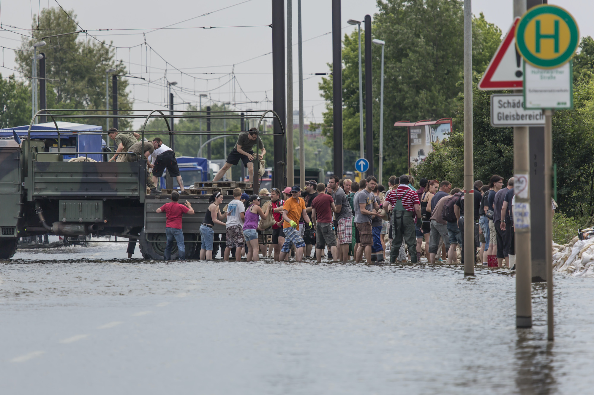 chain of people helping to put sandbags