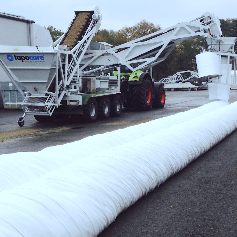 Dike construction machine topomover laying tubes