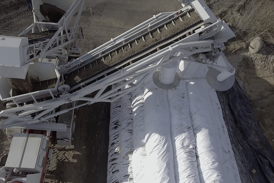 Laying geotextile tubes